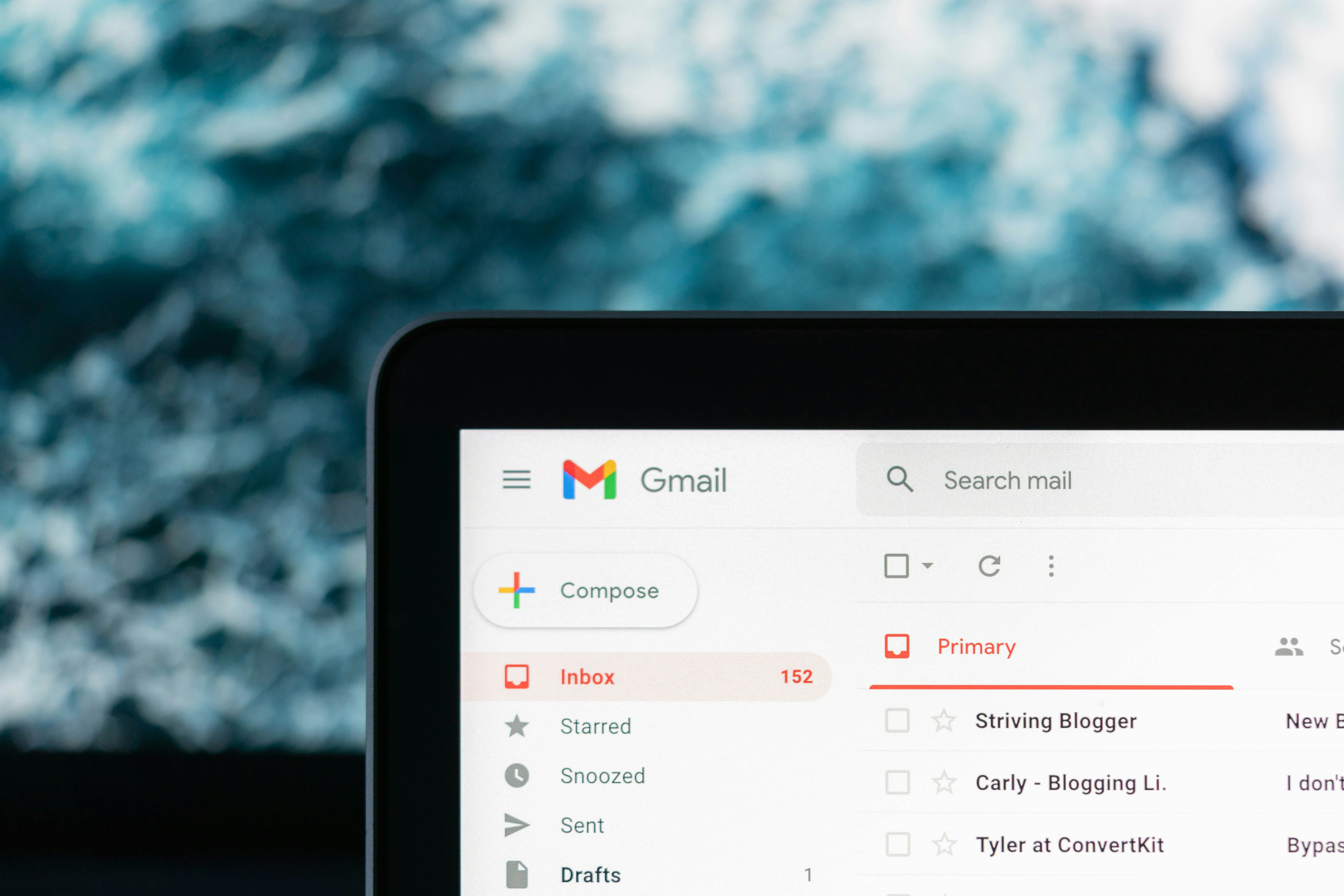 laptop with partial email inbox showing